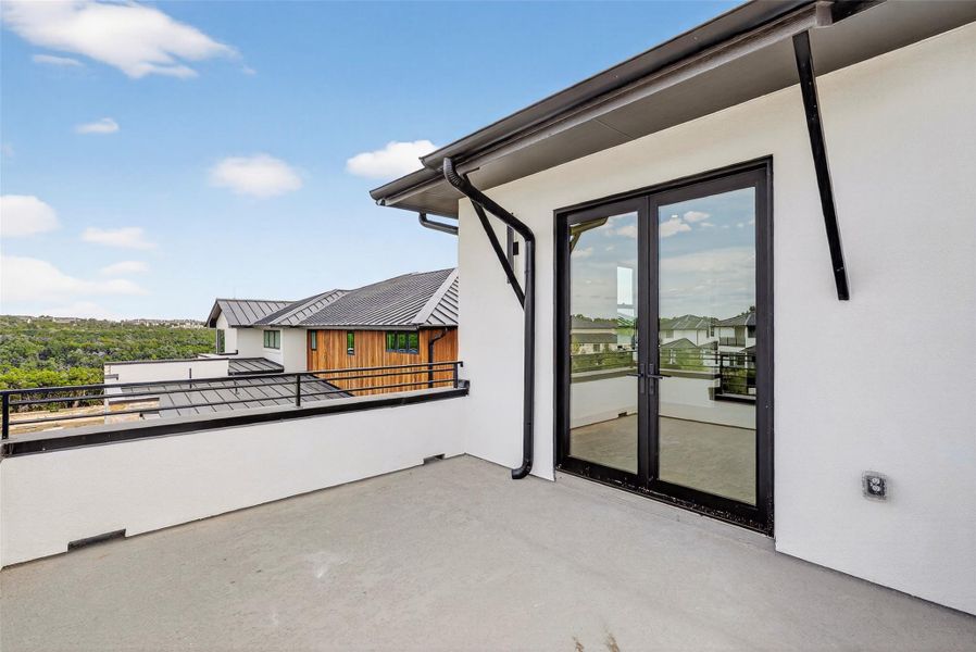 Exterior details and patio area of a home in Milky Way at River Place, Austin (Image 3).