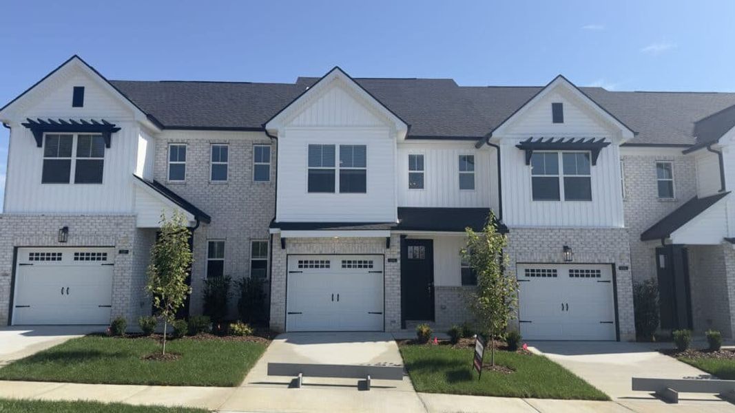 Front exterior of a new home in The Grove at Kennesaw Farms, Gallatin, TN, highlighting curb appeal (Image 1). Front exterior of a new home in The Grove at Kennesaw Farms, Gallatin, TN, highlighting curb appeal (Image 1).