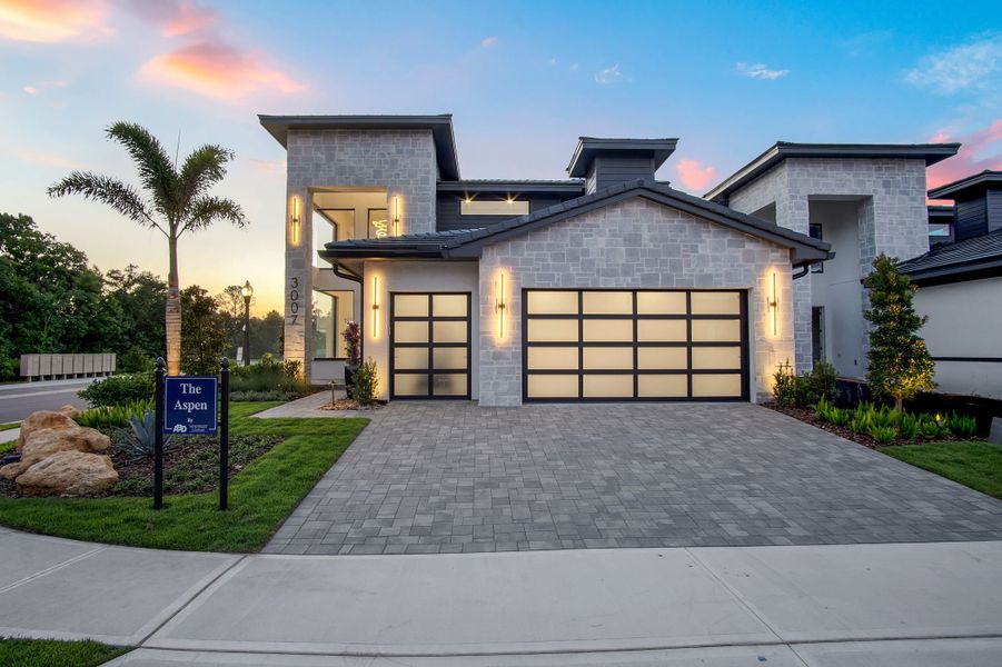 Representative exterior photo of a completed home built from the Aspen Estate by ABD Development in Hampton Green at Providence, Davenport, FL (Image 37). Representative exterior photo of a completed home built from the Aspen Estate by ABD Development in Hampton Green at Providence, Davenport, FL (Image 37).