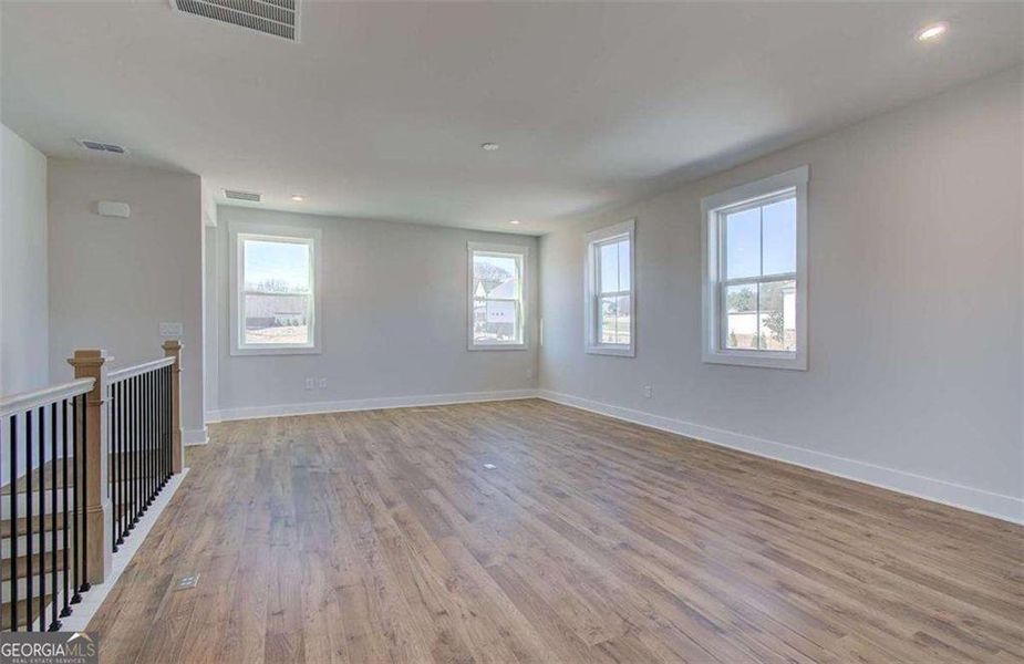 Spacious, unfurnished interior of a new home in The Paddocks at Doc Hughes, Buford (Image 28).