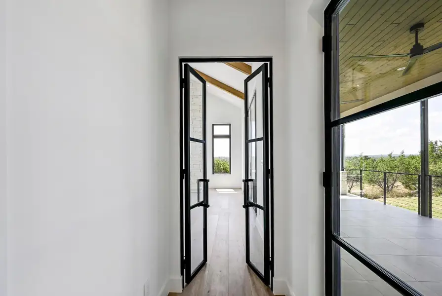 Entry into den with custom steel double doors. Entry into den with custom steel double doors.