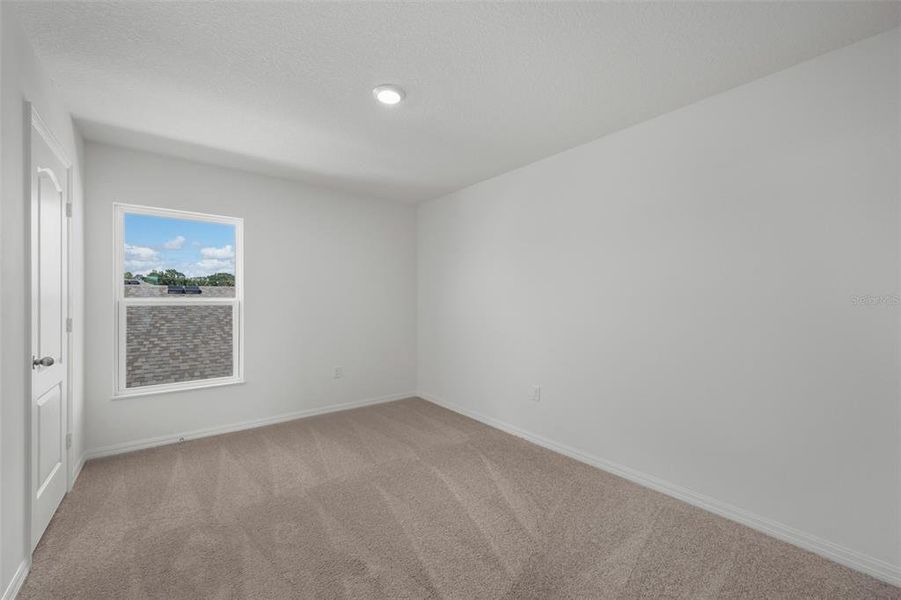 Spacious, unfurnished interior of a new home in Peach Crossings, Winter Haven (Image 23).