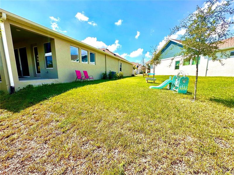 Exterior details and patio area of a home in Eagle Creek - Garden Series, Tarpon Springs (Image 23).