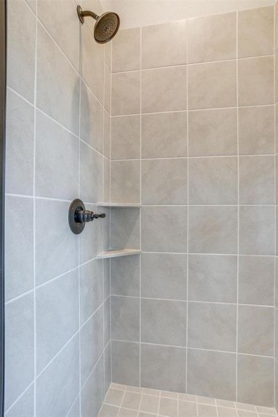 Bathroom with tiled shower