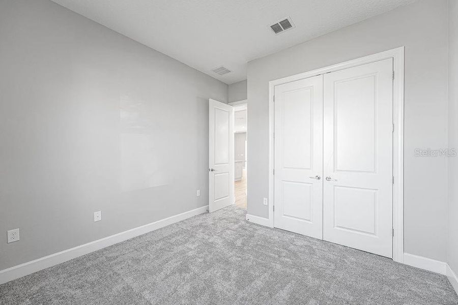 Spacious, unfurnished interior of a new home in Esplanade at Center Lake Ranch, St. Cloud (Image 16).