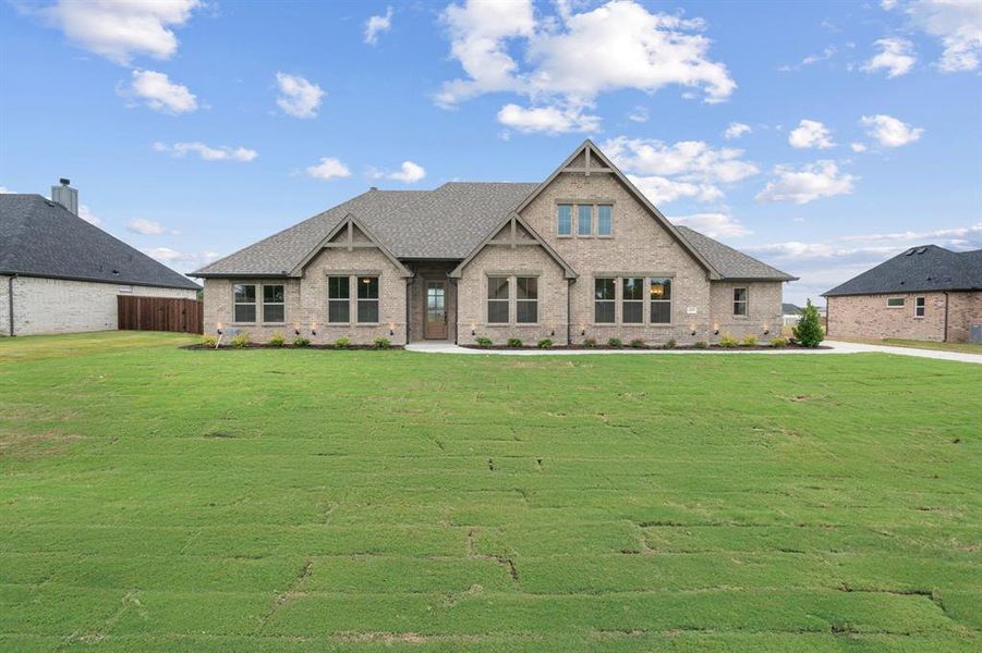 Front exterior of a new home in , Paradise, TX, highlighting curb appeal (Image 2).