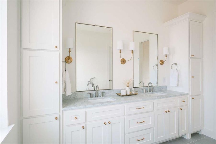 Bathroom with tile patterned flooring and vanity