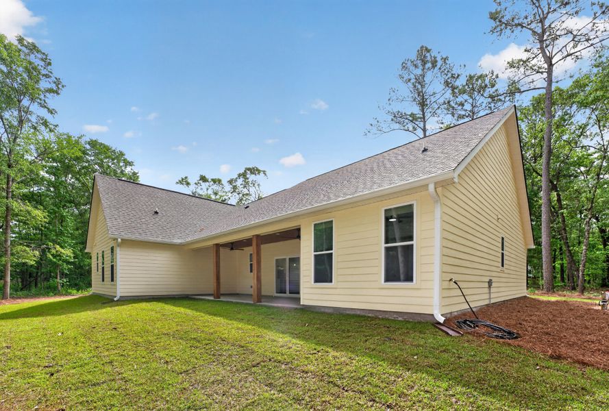 Exterior details and patio area of a home in , Johns Island (Image 25).