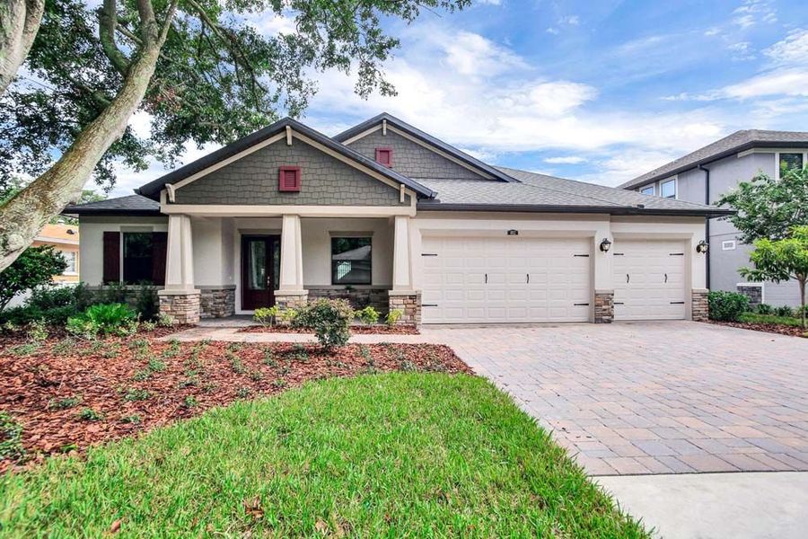 Front exterior of a new home in River Preserve Estates, Parrish, FL, highlighting curb appeal (Image 25).
