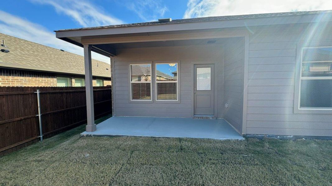 Exterior details and patio area of a home in Monarch at the Meadows, Krum (Image 2).