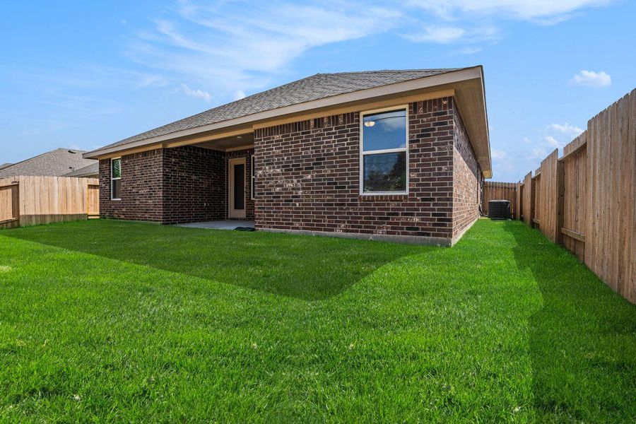 Front exterior of a new home in Kiber Reserve, Angleton, TX, highlighting curb appeal (Image 2).
