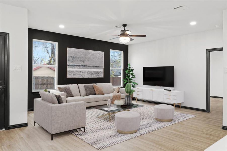 Living room with light hardwood / wood-style flooring and ceiling fan