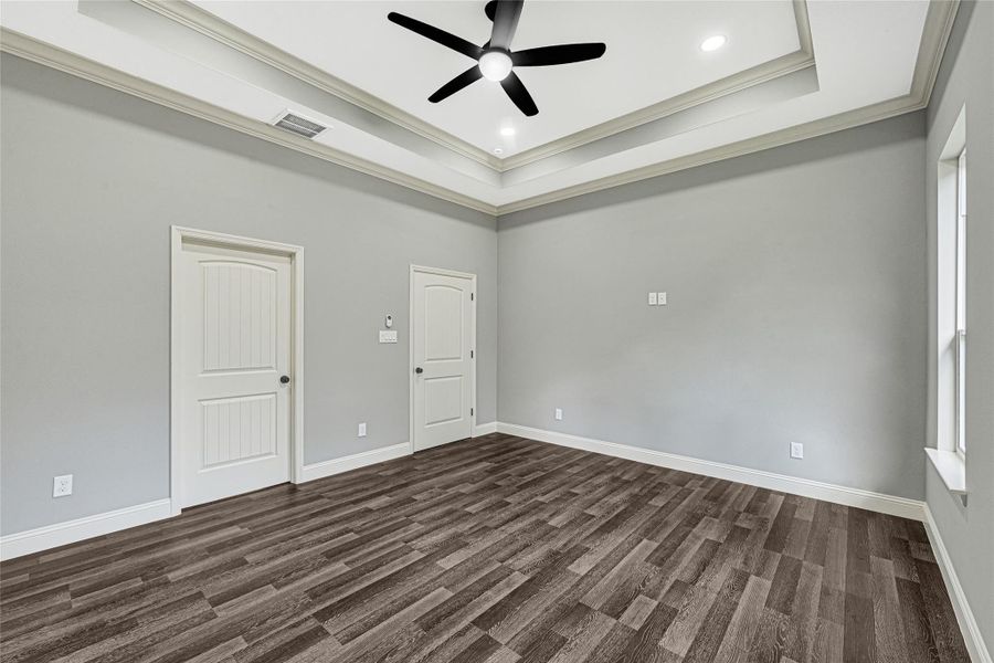 Another view of the primary bedroom, spacious enough for a sitting area, recessed lighting and ceiling fan included. Another view of the primary bedroom, spacious enough for a sitting area, recessed lighting and ceiling fan included.