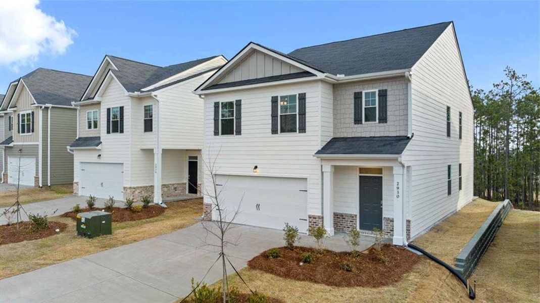 Front exterior of a new home in Shoal Creek, Hampton, GA, highlighting curb appeal (Image 22).