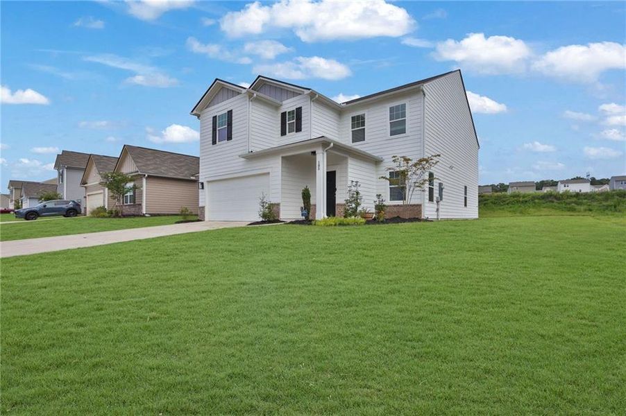 Front exterior of a new home in Casteel, Bethlehem, GA, highlighting curb appeal (Image 2). Front exterior of a new home in Casteel, Bethlehem, GA, highlighting curb appeal (Image 2).