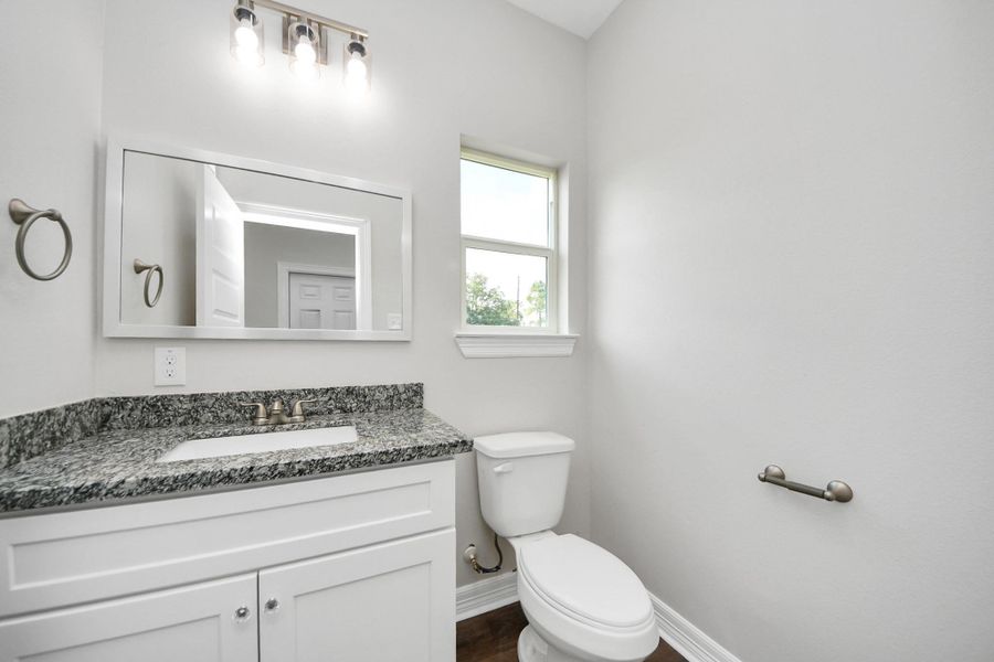 The first-floor half bathroom offers a practical and stylish space, easily accessible for guests and family while blending seamlessly with the home’s overall design - (representation photo).