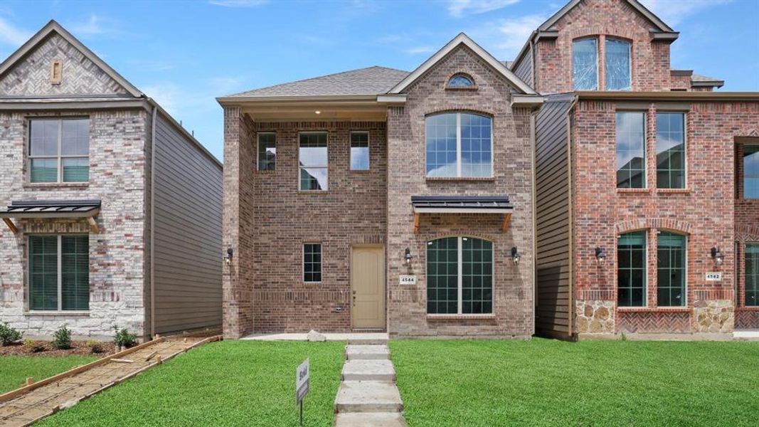 Front exterior of a new home in The Avenue, Allen, TX, highlighting curb appeal (Image 2). Front exterior of a new home in The Avenue, Allen, TX, highlighting curb appeal (Image 2).