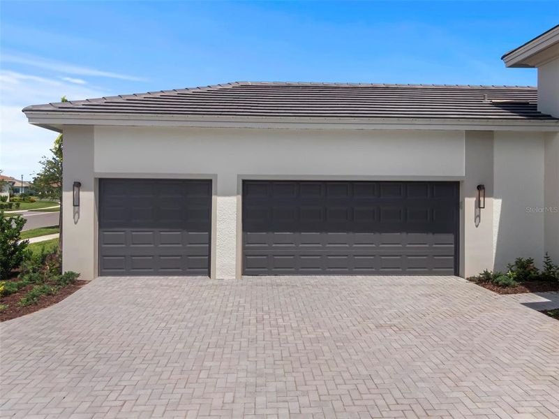 Front exterior of a new home in Cresswind Lakewood Ranch, Lakewood Ranch, FL, highlighting curb appeal (Image 2).