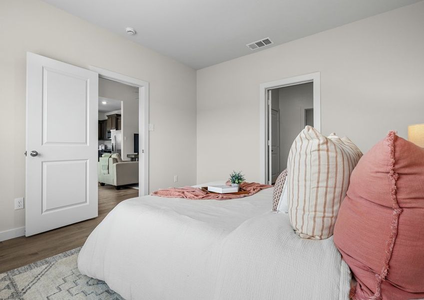 The master suite has a large bedroom, ensuite bathroom and walk-in closet.