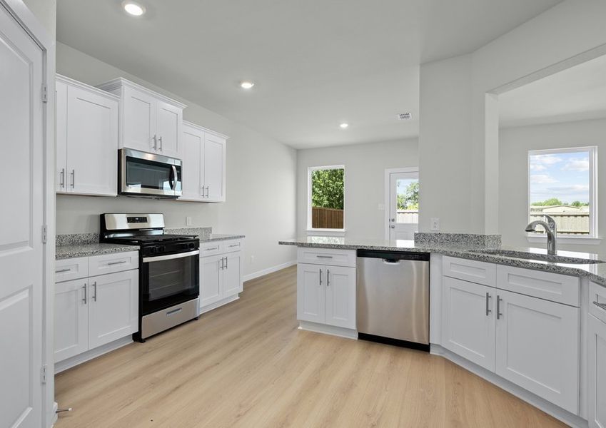 All stainless steel appliances are included in the kitchen.