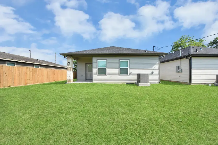 Exterior details and patio area of a home in , Baytown (Image 3).