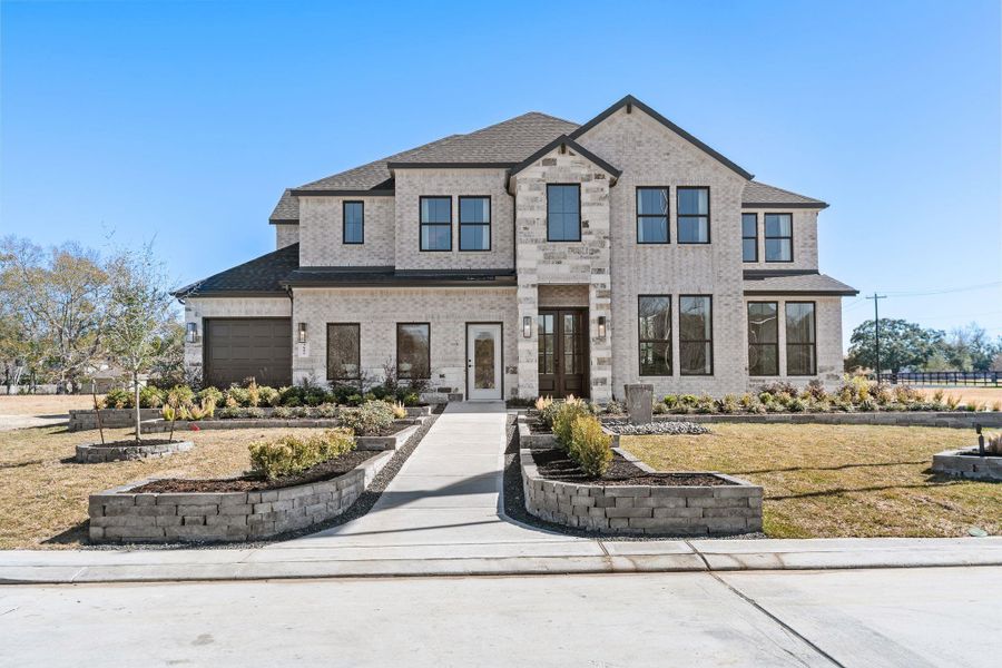 Front exterior of a new home in , Friendswood, TX, highlighting curb appeal (Image 23). Front exterior of a new home in , Friendswood, TX, highlighting curb appeal (Image 23).