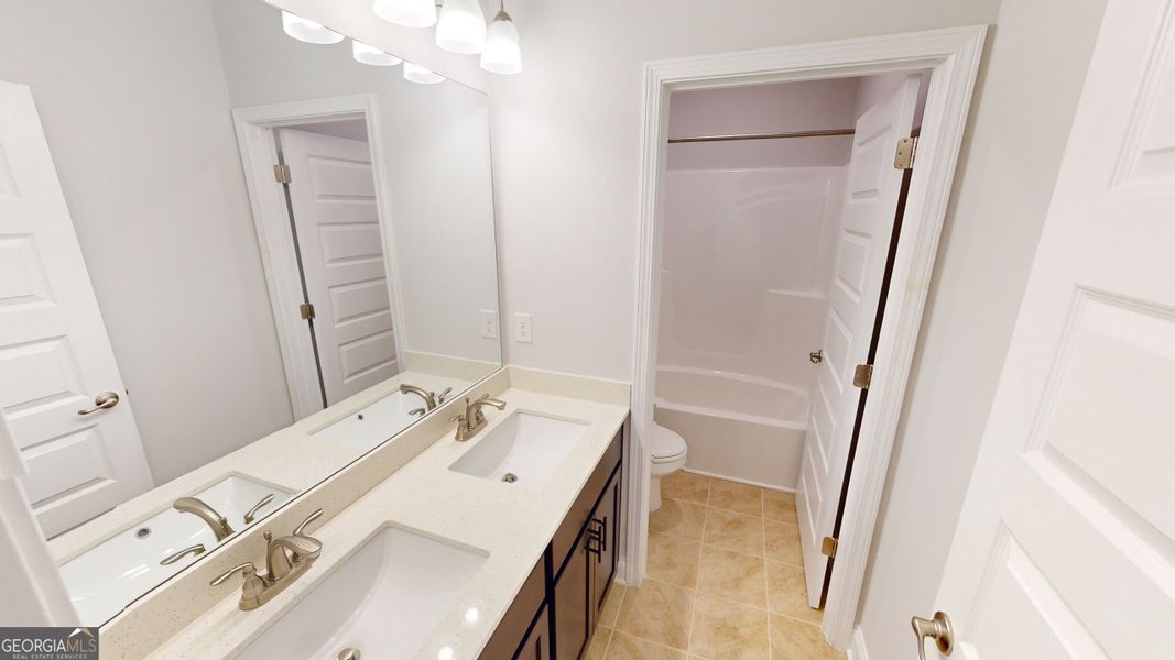 Furnished interior view inside a new home in Oakview Estates, Macon (Image 13).