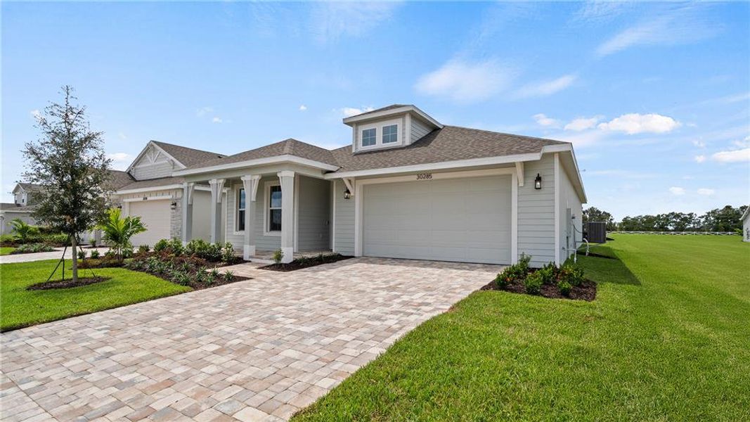 Front exterior of a new home in Trailside, Mount Dora, FL, highlighting curb appeal (Image 17).