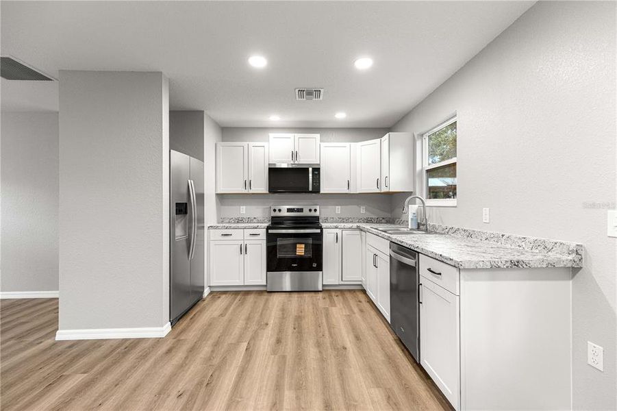 Furnished interior view inside a new home in , Fort McCoy (Image 3).