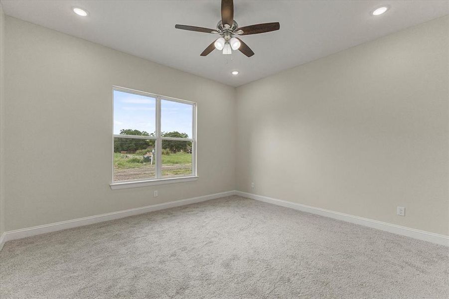 Unfurnished room with recessed lighting, carpet, and ceiling fan