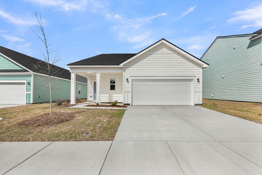 Front exterior of a new home in , Ravenel, SC, highlighting curb appeal (Image 19).