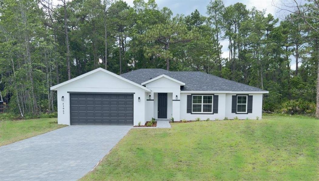 Front exterior of a new home in , Eustis, FL, highlighting curb appeal (Image 1). Front exterior of a new home in , Eustis, FL, highlighting curb appeal (Image 1).