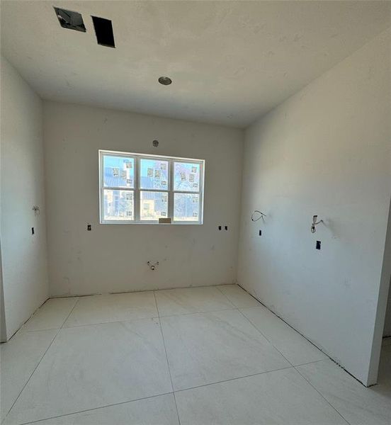 Huge sep utility room with upper lower cabinets.