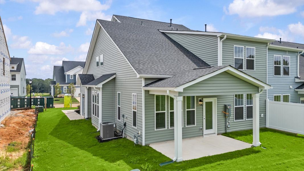 Notable exterior includes a rear covered porch designed for year-round enjoyment