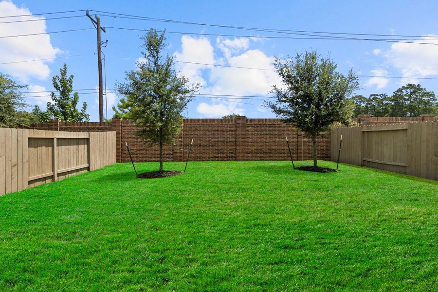 Exterior details and patio area of a home in Presswoods, Splendora (Image 4).