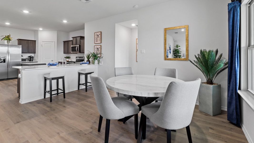 Representative furnished interior of a home built from the X40T Travis by D.R. Horton in Valor Farms, Royse City (Image 6).