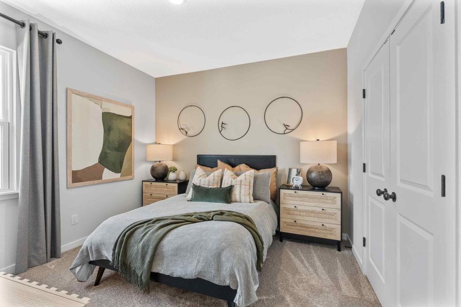 Silverbell II Model Home Guest Room with Bed and Nighstands at Camden Woods in Kingsland, GA