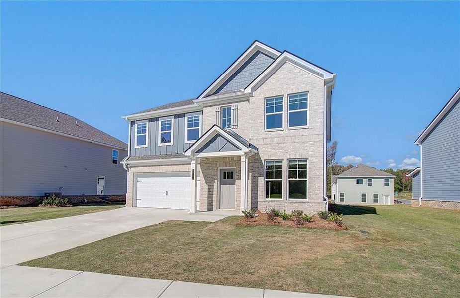 Front exterior of a new home in Westminster, Covington, GA, highlighting curb appeal (Image 16). Front exterior of a new home in Westminster, Covington, GA, highlighting curb appeal (Image 16).