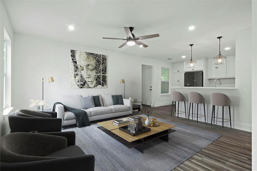 Digitally Staged Living room featuring baseboards, dark wood finished floors, a ceiling fan, and recessed lighting