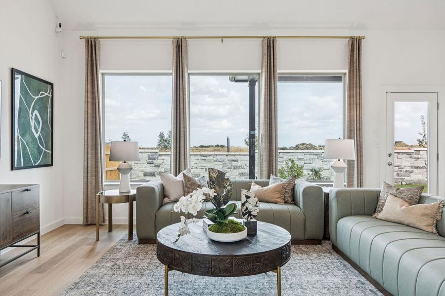 Living Room in the Trinity home plan by Trophy Signature Homes – REPRESENTATIVE PHOTO Living Room in the Trinity home plan by Trophy Signature Homes – REPRESENTATIVE PHOTO