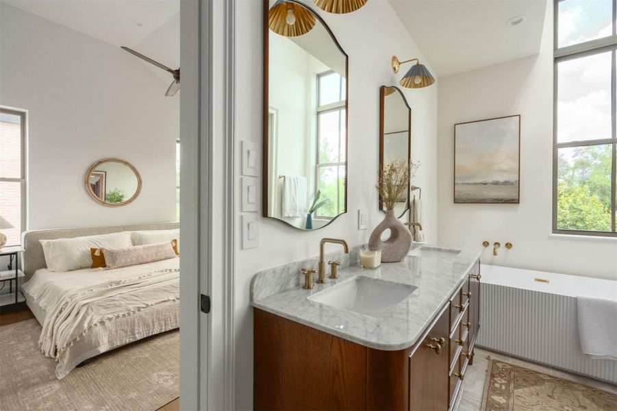 A spacious vanity with stone counters connects seamlessly to the main bedroom suite. A spacious vanity with stone counters connects seamlessly to the main bedroom suite.
