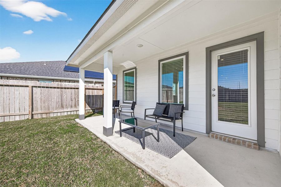 Covered extended back patio, back yard access from the living room. Covered extended back patio, back yard access from the living room.