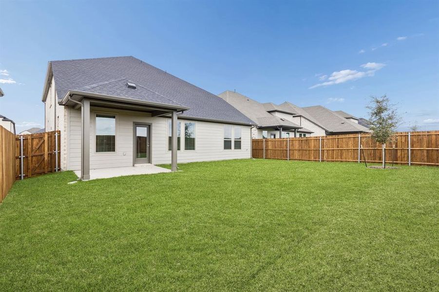 Covered Patio in the Winters home plan by Trophy Signature Homes – REPRESENTATIVE PHOTO