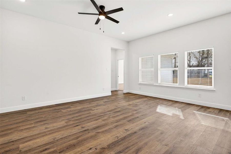 Empty room with wood finished floors, recessed lighting, and a ceiling fan