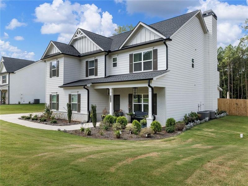 Front exterior of a new home in , Bethlehem, GA, highlighting curb appeal (Image 21).
