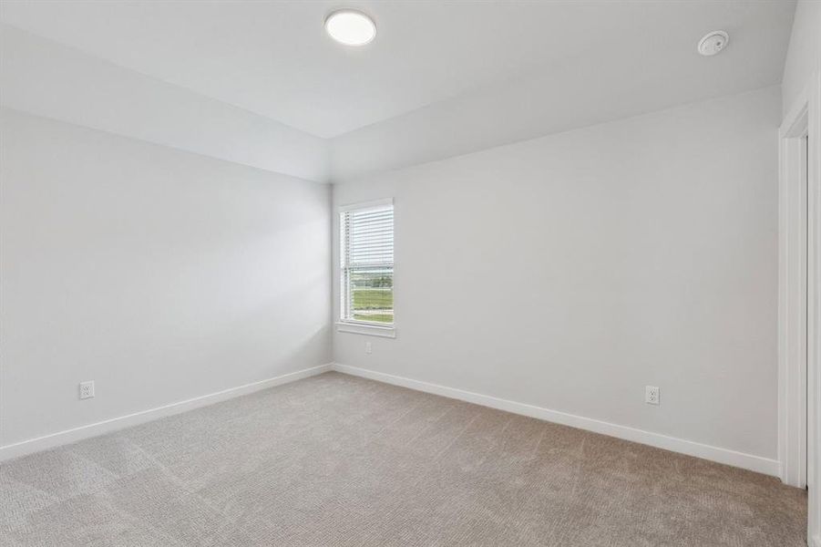 Bedroom in the Stanley II home plan by Trophy Signature Homes – REPRESENTATIVE PHOTO