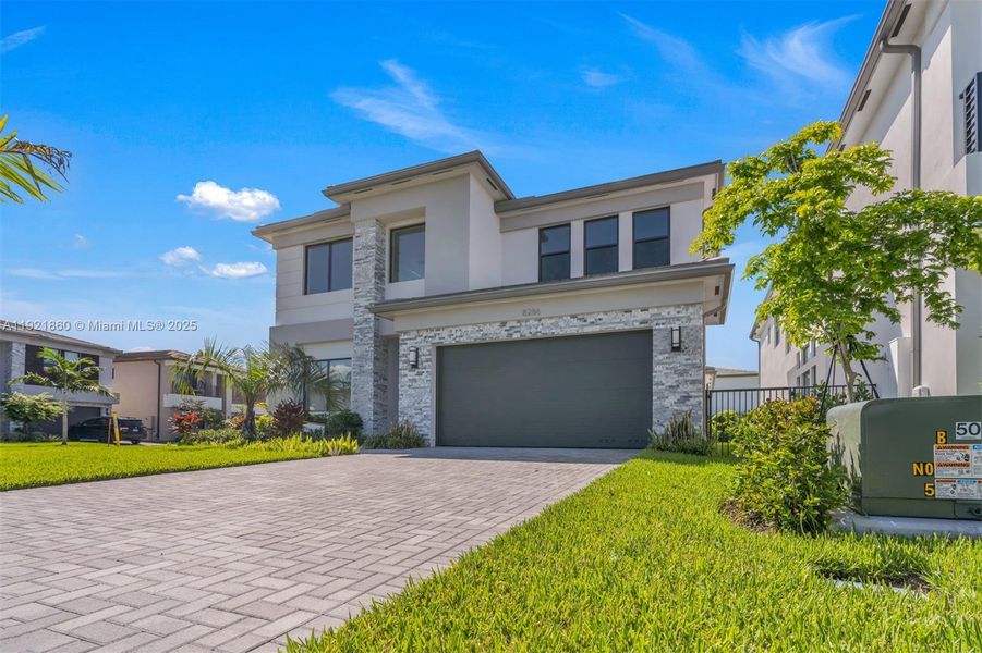 Front exterior of a new home in , Boca Raton, FL, highlighting curb appeal (Image 31). Front exterior of a new home in , Boca Raton, FL, highlighting curb appeal (Image 31).