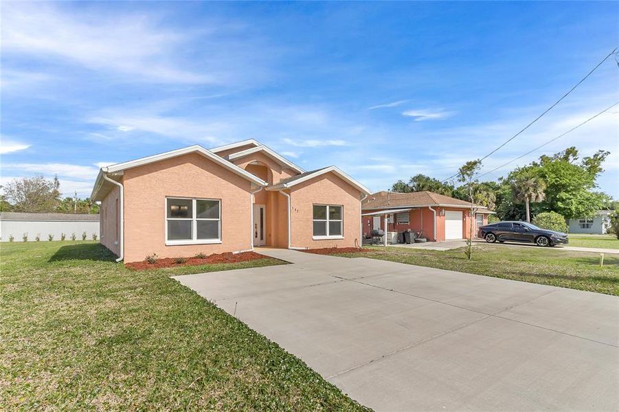 Front exterior of a new home in , New Smyrna Beach, FL, highlighting curb appeal (Image 19). Front exterior of a new home in , New Smyrna Beach, FL, highlighting curb appeal (Image 19).