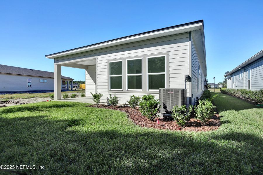 Exterior details and patio area of a home in Reverie at TrailMark, St. Augustine (Image 3). Exterior details and patio area of a home in Reverie at TrailMark, St. Augustine (Image 3).