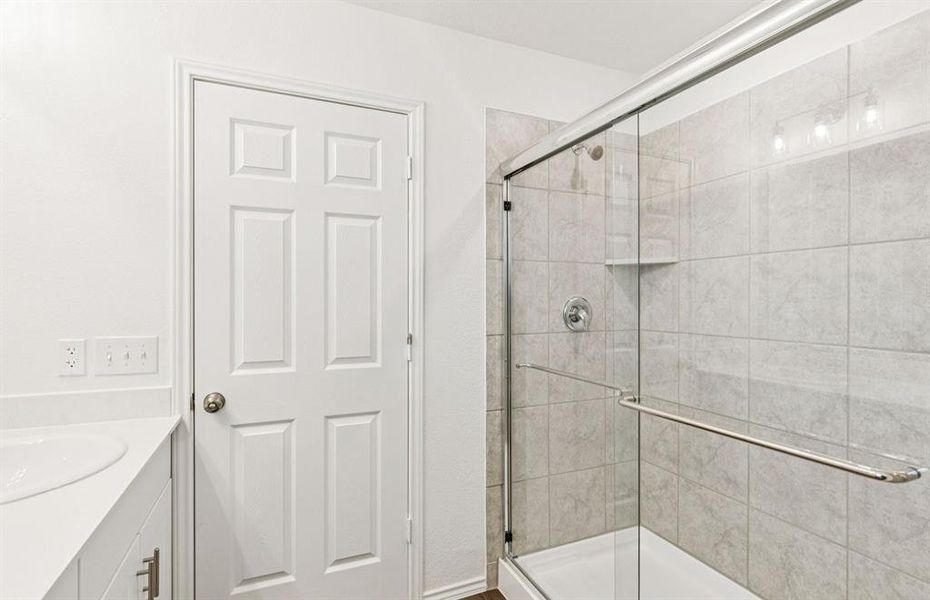 Deep walk-in shower designed for relaxation in the owner's bath *Real home pictured Deep walk-in shower designed for relaxation in the owner's bath *Real home pictured